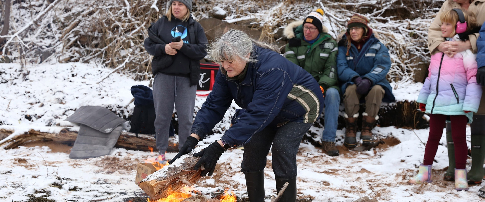 Feeding the Fire Sandy Cove Polar Bear by  Karla Kelly